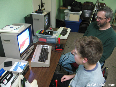 Tom and his son Ian playing Artillery Duel on the C64 - Commodore Computer Club