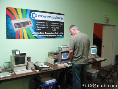 Commodore Computer Club banner above retro Commodore computers